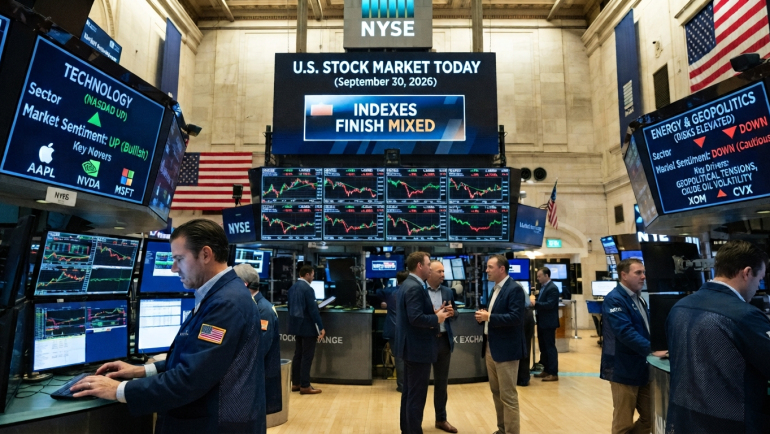 Traders work on the New York Stock Exchange floor beneath market screens showing mixed U.S. stock index performance, with technology-sector gains and elevated energy and geopolitical risks on September 30, 2026.
